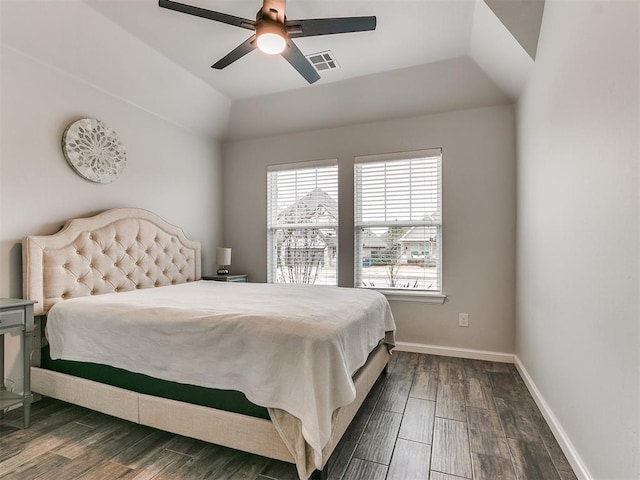 bedroom featuring lofted ceiling, dark hardwood / wood-style floors, and ceiling fan