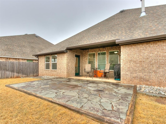 back of house with a patio