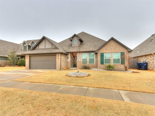 view of front facade with a garage and a front yard