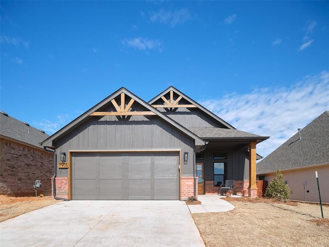 craftsman inspired home featuring a garage, covered porch, brick siding, a shingled roof, and driveway