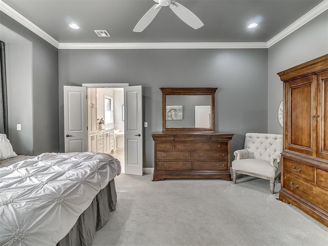 bedroom featuring ornamental molding, connected bathroom, light carpet, and ceiling fan