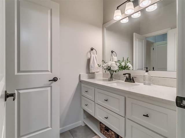 bathroom with vanity and tile patterned flooring