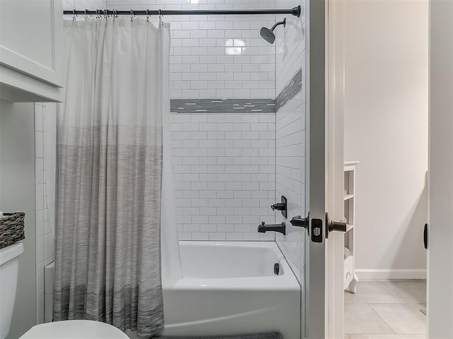 bathroom featuring tile patterned floors, toilet, and shower / tub combo