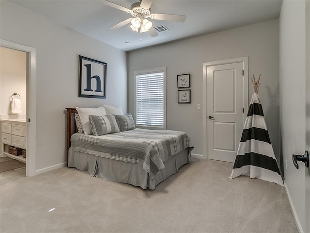 carpeted bedroom featuring ceiling fan and ensuite bathroom