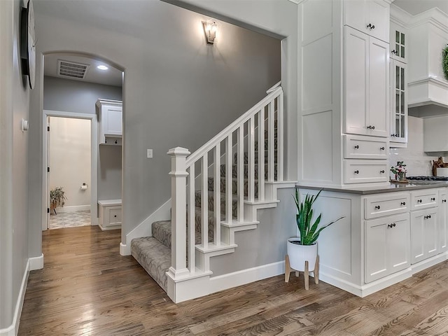 stairway with wood-type flooring