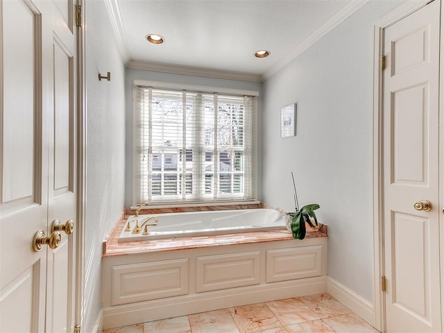 bathroom featuring a washtub and crown molding