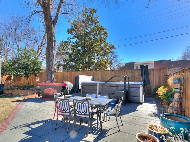 view of patio / terrace featuring a hot tub