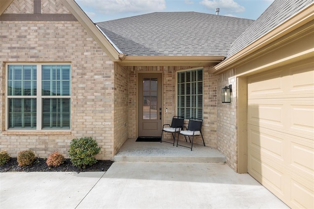 view of exterior entry featuring a garage