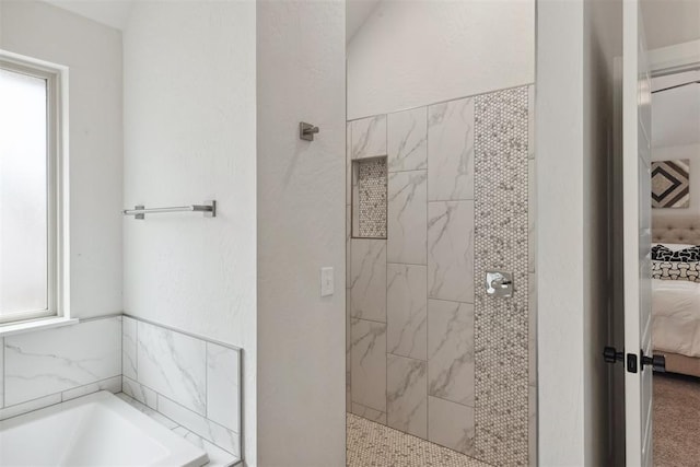 bathroom with separate shower and tub