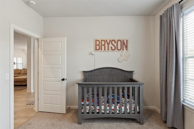 bedroom featuring a nursery area