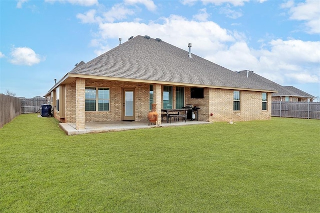 back of property featuring a yard and a patio area