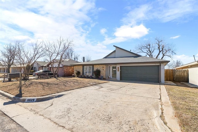 ranch-style home featuring a garage