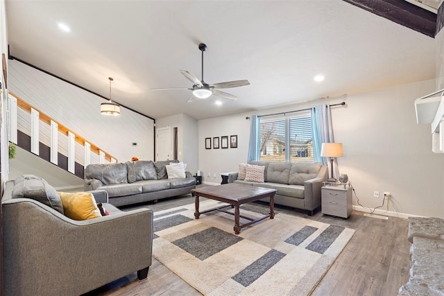 living room with hardwood / wood-style flooring and ceiling fan