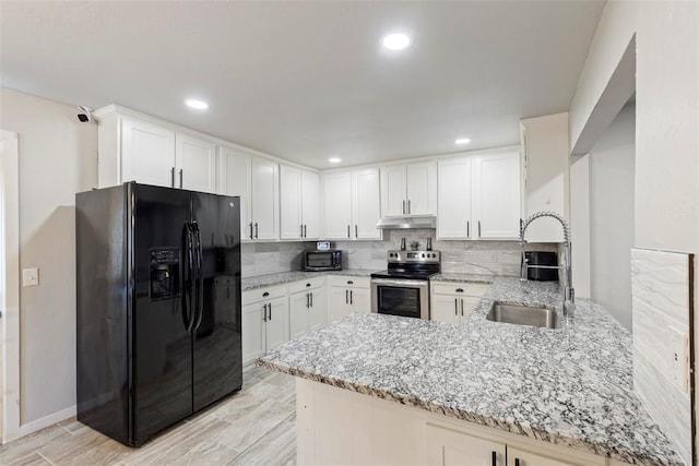 kitchen with sink, stainless steel electric range, white cabinetry, black fridge with ice dispenser, and kitchen peninsula