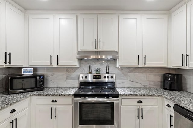 kitchen with tasteful backsplash, appliances with stainless steel finishes, and white cabinets