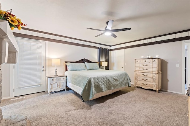 bedroom with light carpet, crown molding, and ceiling fan