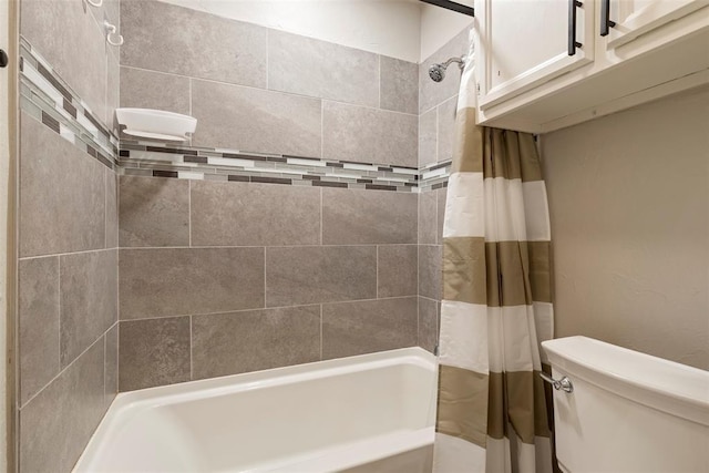 bathroom with shower / bath combo and toilet