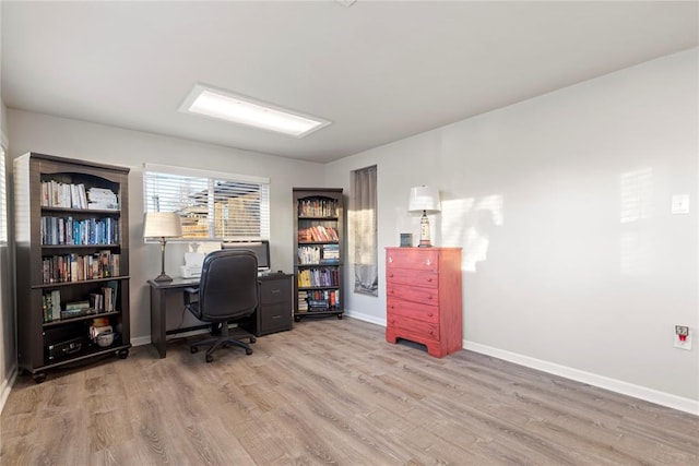 office with light wood-type flooring