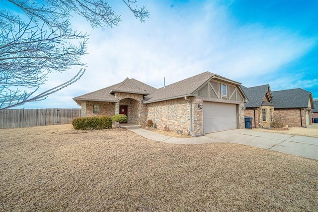 view of front of house featuring a garage and a front lawn