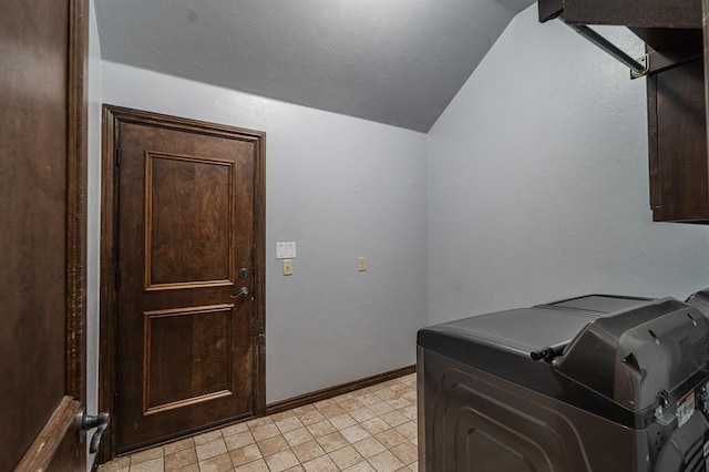 clothes washing area with washer and clothes dryer