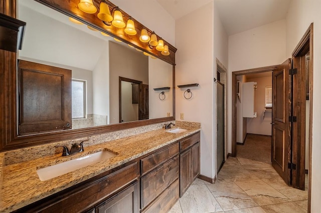 bathroom featuring vanity and vaulted ceiling