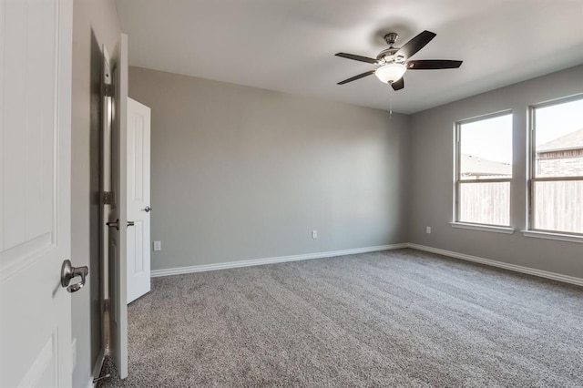 unfurnished room featuring carpet floors and ceiling fan