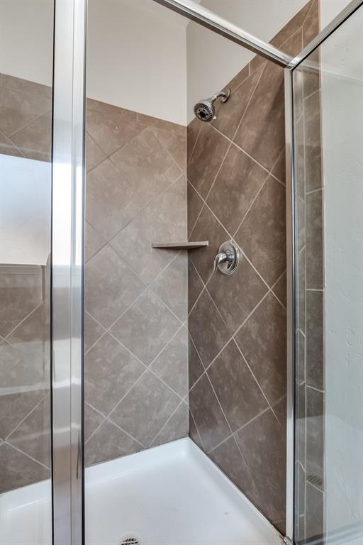 bathroom featuring walk in shower