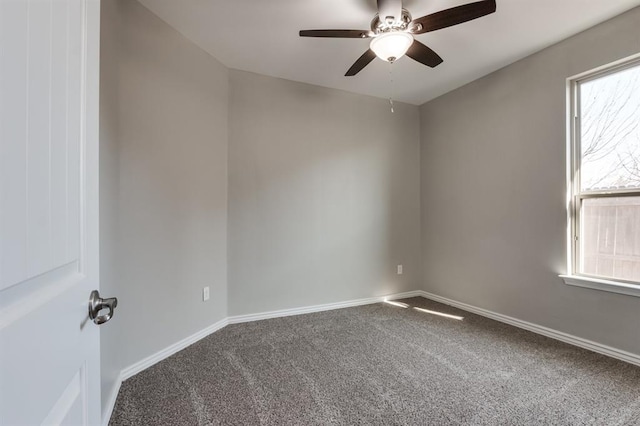 spare room with carpet flooring and ceiling fan