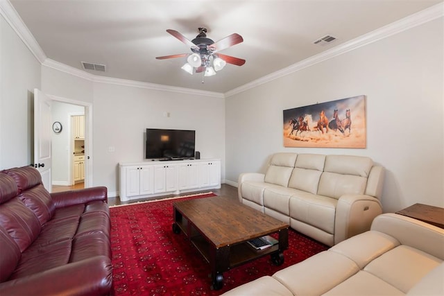 living room with ceiling fan and ornamental molding