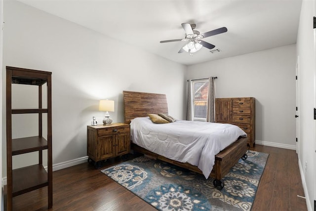 bedroom with ceiling fan and dark hardwood / wood-style flooring