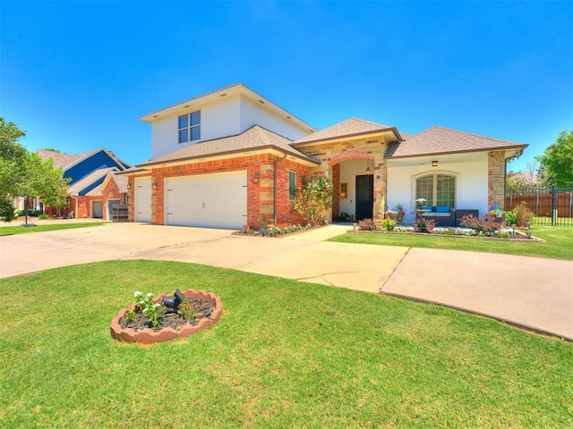 view of front facade with a garage and a front lawn