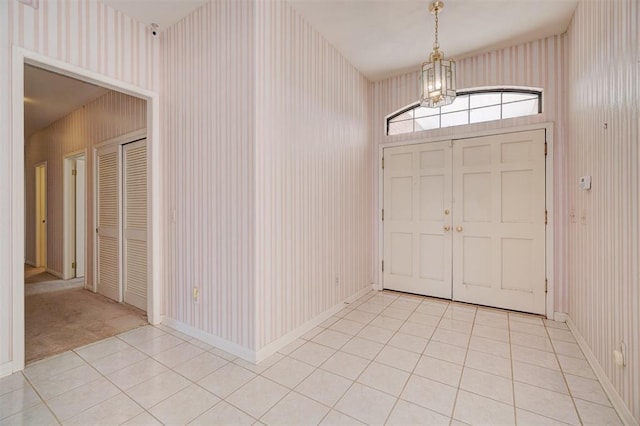 entryway with light tile patterned floors