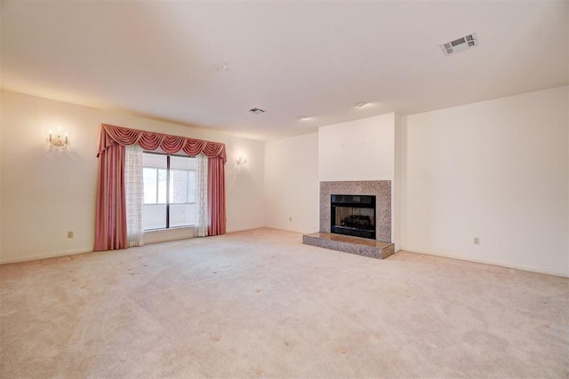 unfurnished living room featuring light colored carpet