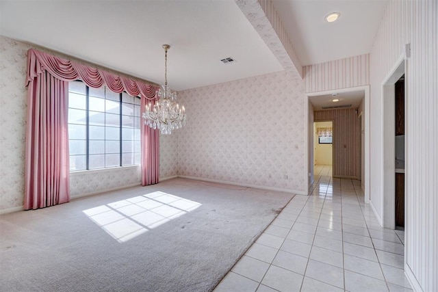 unfurnished dining area with light colored carpet and a chandelier