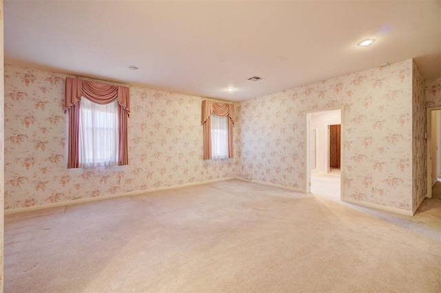 unfurnished room featuring carpet