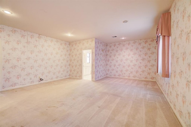 empty room with light colored carpet