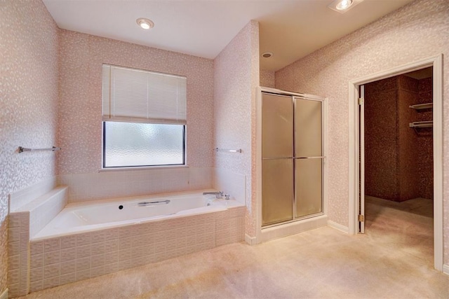 bathroom with separate shower and tub