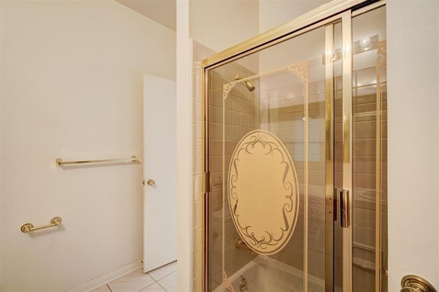 bathroom featuring a shower with door and tile patterned floors