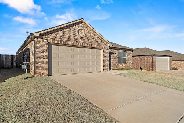 view of front of house featuring a garage and a front yard