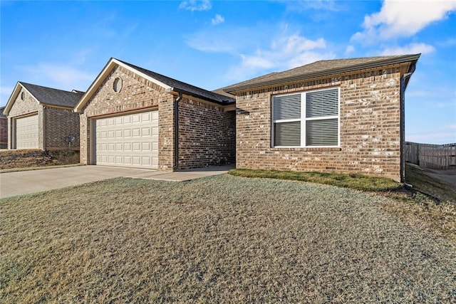 view of front of home featuring a garage and a front lawn