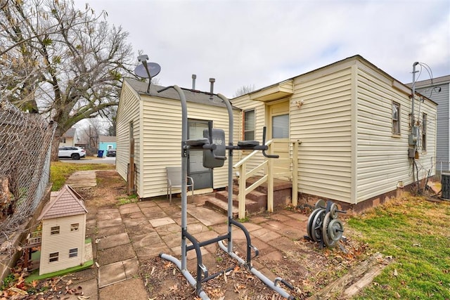 back of property with a patio area