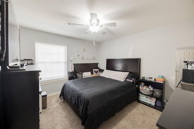 bedroom featuring ceiling fan and light carpet