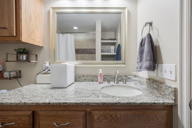 bathroom with a shower with curtain and vanity