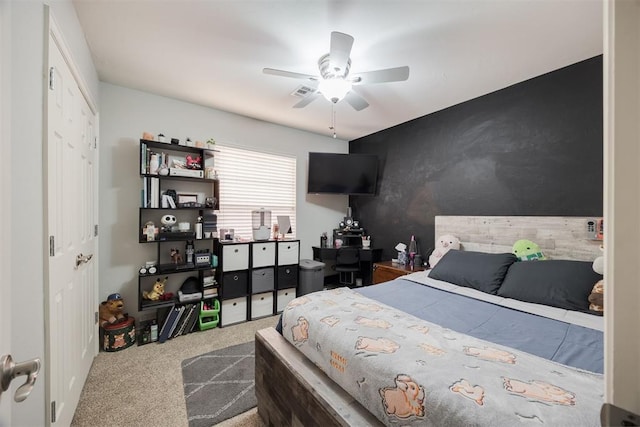 carpeted bedroom featuring ceiling fan