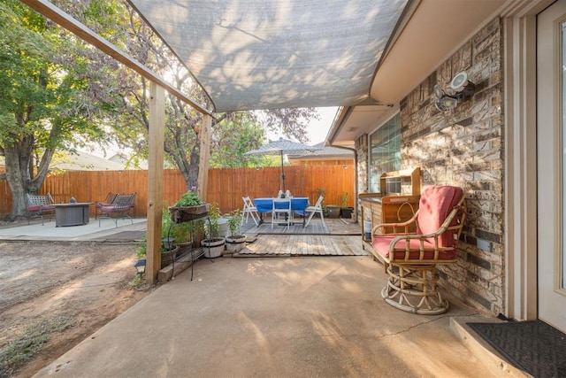 view of patio featuring a fire pit