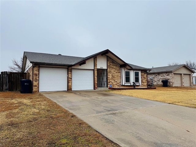 ranch-style home featuring a garage and a front yard