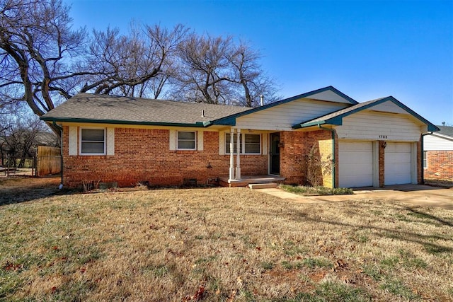 ranch-style house with a garage and a front yard