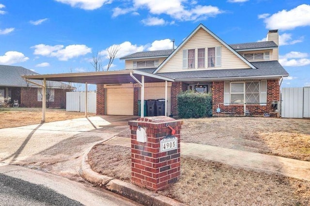 view of front of home with a garage and a carport