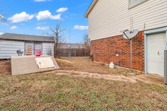 view of storm shelter with a lawn