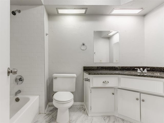 full bathroom with tiled shower / bath, vanity, and toilet